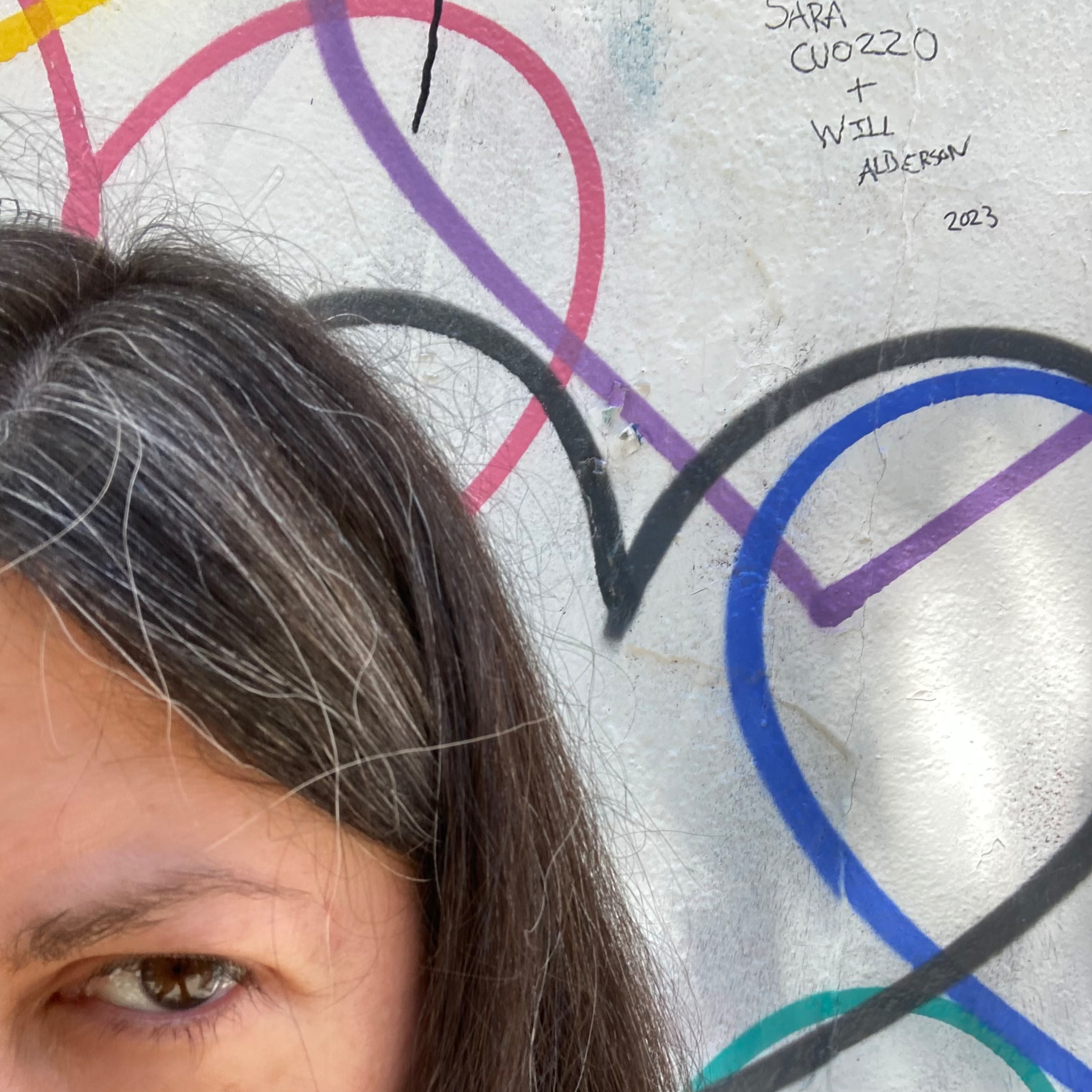 left-eyed quarter face against graffiti hearts